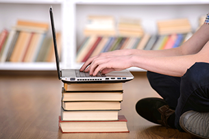 Girl typing on laptop